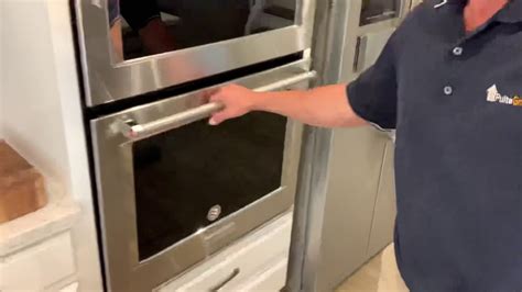 how to take the door off a whirlpool stove